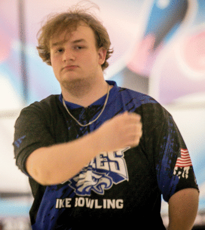  Utica Eisenhower junior Logan Milasinovich walks back to his teammates after a shot during Eisenhower’s preseason meet on Dec. 4 at Imperial Lanes. 