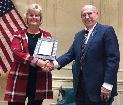  Grosse Pointe Woods Mayor Arthur Bryant, right, congratulates Woods Treasurer/Comptroller Shawn Murphy on her award-winning audit report during a Nov. 21 City Council meeting. 