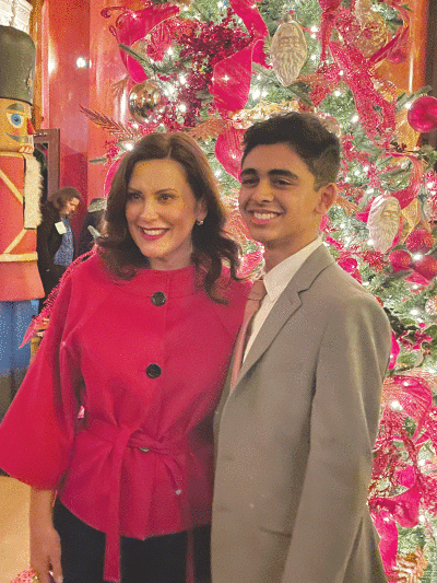  Troy High School senior Krish Ghosalkar was one of three students from Troy recognized by Michigan Gov. Gretchen Whitmer, pictured, at  the 2022 Michigan Governor’s Service Awards Nov. 17 for his  efforts in streamlining online donations for nonprofits. 