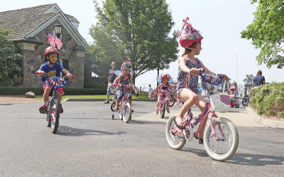  The decorated bicycle parade — seen here during the last Grosse Pointe Farms Regatta in 2019 — is always one of the highlights of this event. 