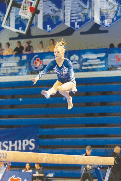  Senior Grace Spencer, pictured, finished tied for eighth in the all-around at the Michigan High School Athletic Association Division 2 State Championship. 