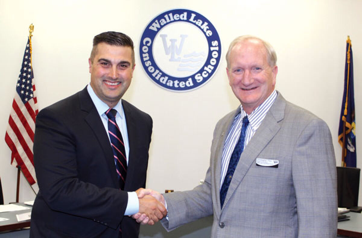  This past September, the Walled Lake Consolidated Schools Board of Education selected John Bernia, left, to be the district’s new superintendent. 