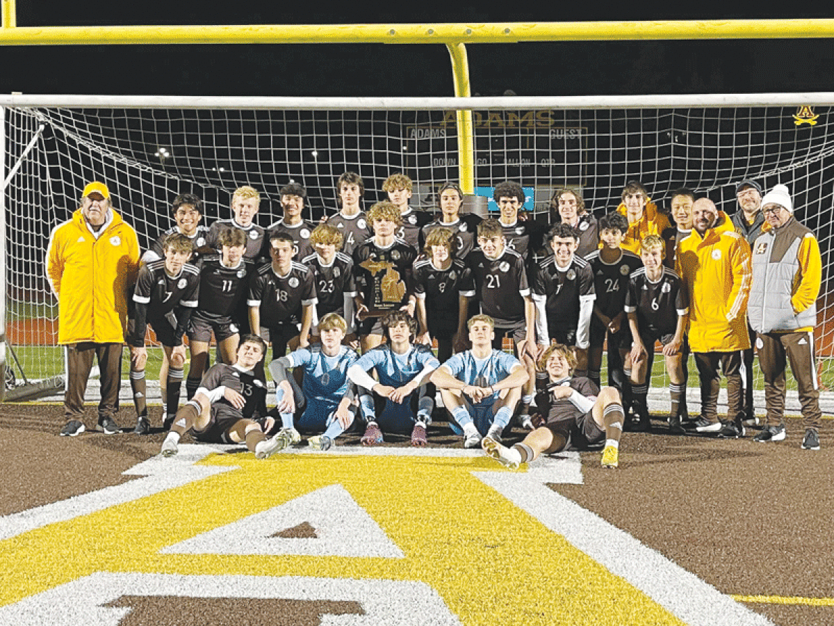  Rochester Adams takes a team photo after their 3-2 regional championship win over New Baltimore Anchor Bay Oct. 27 at Rochester Adams High School. 