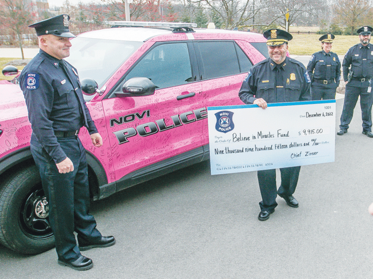  Members of the Novi Police Department present the Michael and Rose Assarian Cancer Center at Ascension Providence Hospital in Novi with a donation of funds raised through two fundraisers Dec. 6. 