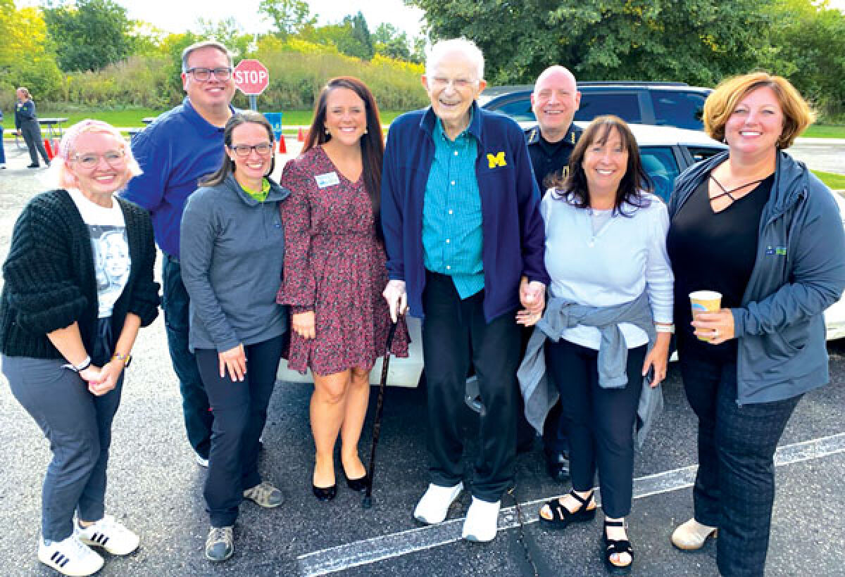  Pastor Jack Freed, center, is pictured at a previous Food Truck Tuesday event. Freed held an influential position in multiple ways in the West Bloomfield community. 
