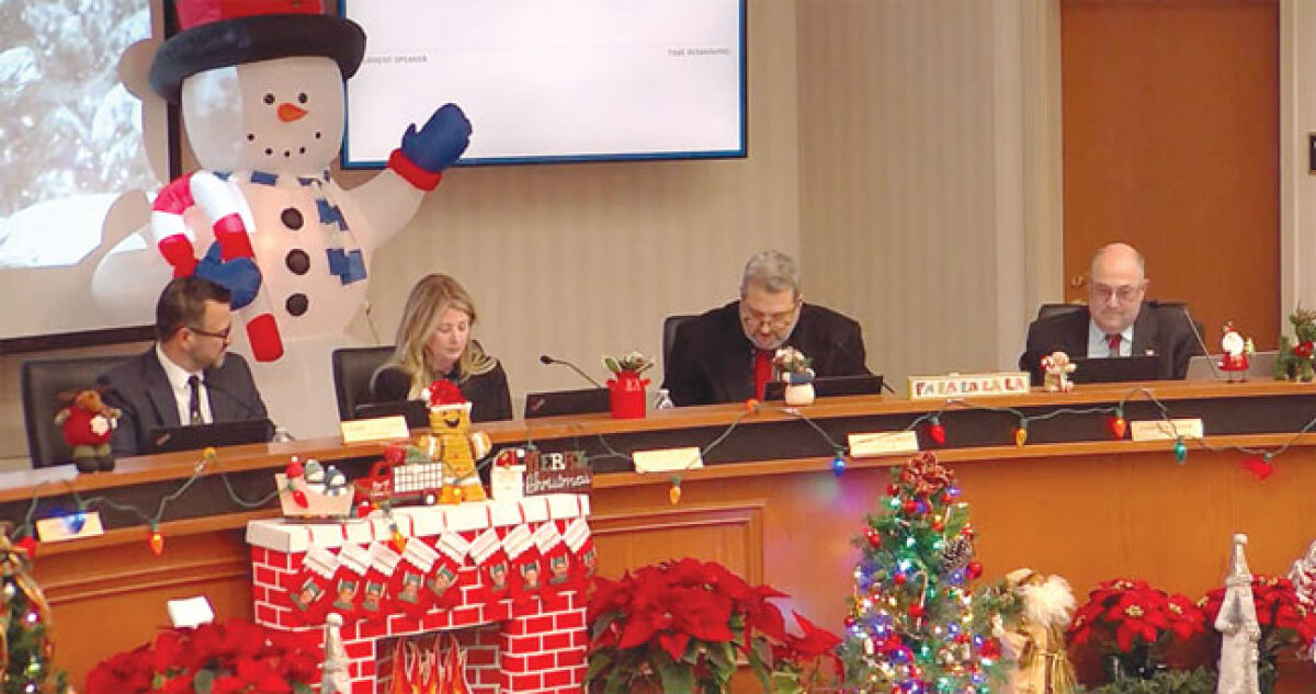  Festive decorations adorned the Macomb Township Hall for the Dec. 21 Board of Trustees meeting. Decor was not the only seasonal display at the meeting, as the family of Trustee Peter Lucido gifted the township $125,000 to cover the cost of a new park.  
