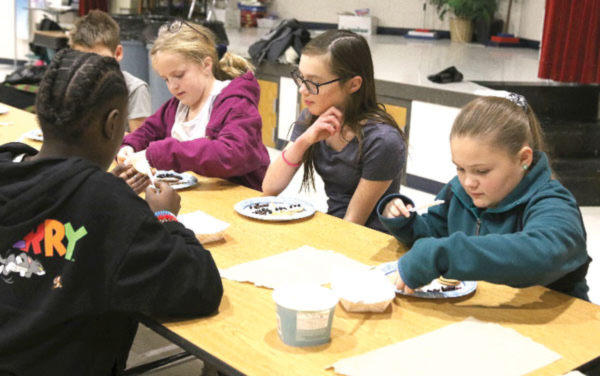  Elementary School students create healthy snowman snacks at their Building Healthy Communities meeting in early December. 