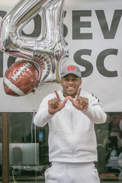  Snowden throws up the Wisconsin “W” to celebrate his commitment to the university. 