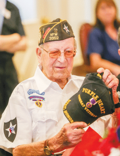  Raymond Tarabusi was given a new hat designating his combat veteran status. He is known to always have a hat. 