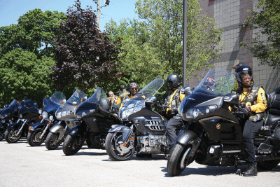  Members of the Buffalo Soldiers Motorcycle Club park their bikes in a row outside the Cairns Community Center June 18 as part of the Juneteenth Celebration. 