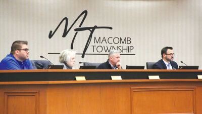  Members of the Macomb Township Board of Trustees — (left to right) Trustee Peter Lucido, Trustee Nancy Nevers, Treasurer Leon Drolet and Township Supervisor Frank Viviano — listen as Department of Public Works Director Kevin Johnson discusses purchasing new trucks on Jan. 11. 