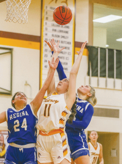  Farmington Hills Mercy senior Lauren Smiley takes the ball up against Warren Regina on Jan. 17 at Mercy High School.  