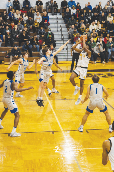  North Farmington junior Tyler Spratt attempts a fadeaway shot against Detroit Catholic Central Dec. 13 at North Farmington High School. 