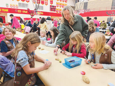  Brownie Troop 77381 from Hill Elementary School paints rocks to spread kindness throughout the community for Martin Luther King Jr. Day. 