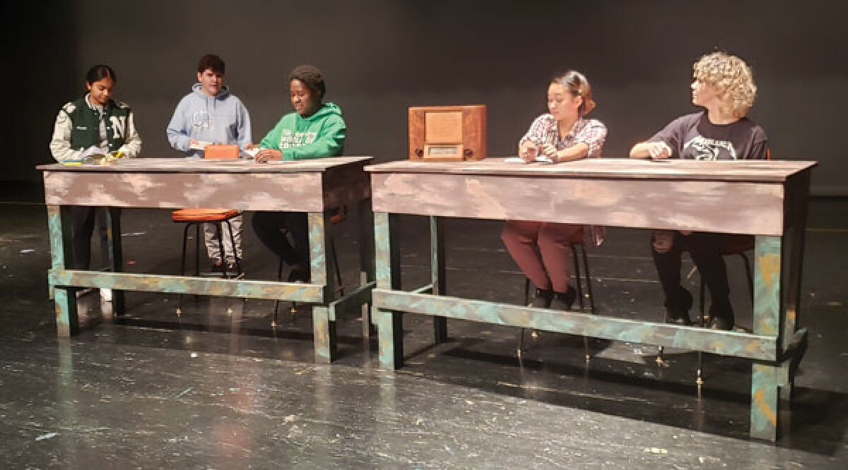  Members of the cast of “These Shining Lives,” from left, Arushi Singh, Brandon Gilger, Nicole Watts, Lilly Balino and Sadie Charles, rehearse at Novi High School last week. 