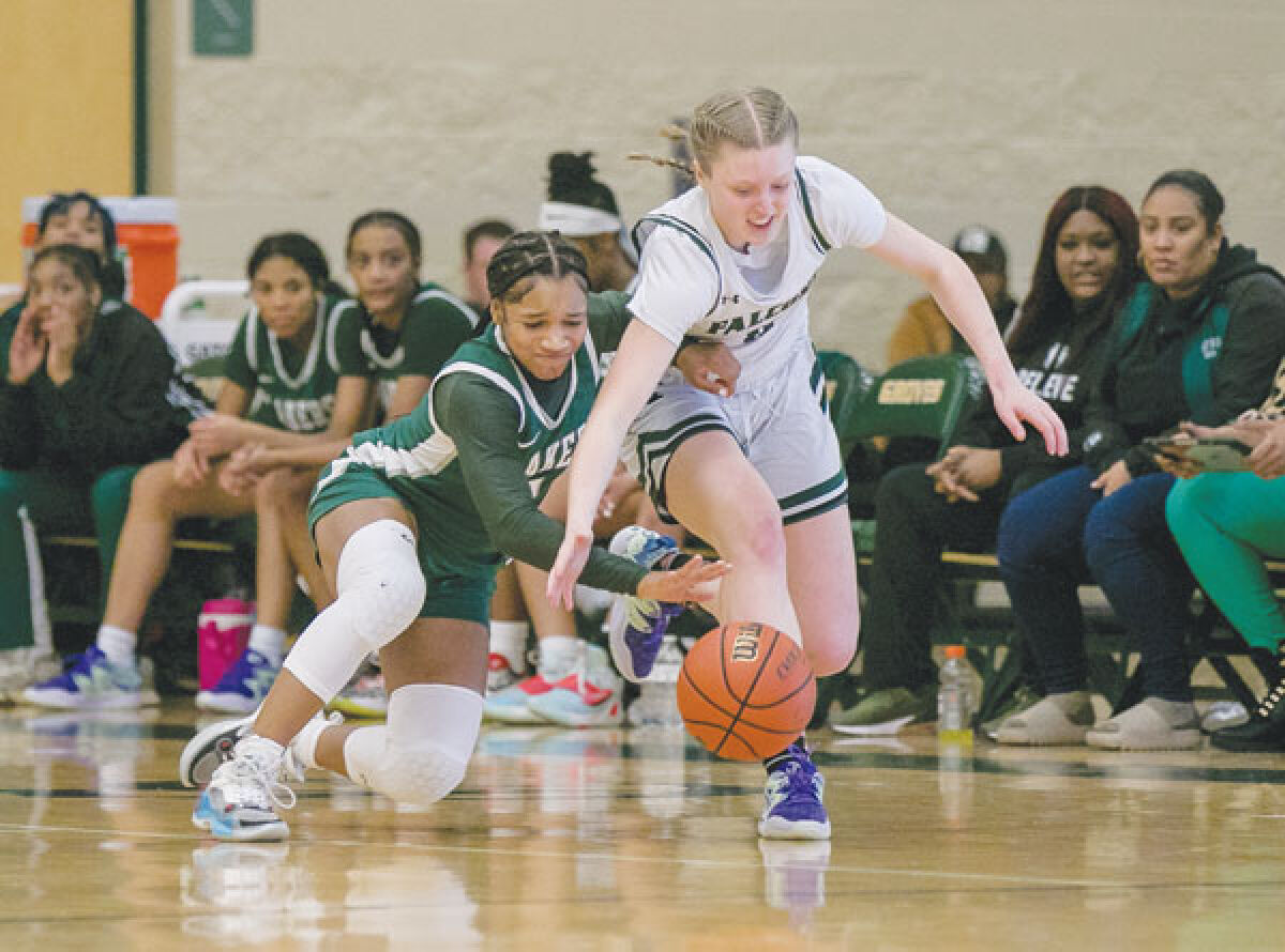  West Bloomfield junior guard Destiny Washington dives after the ball against Birmingham Groves Jan. 27 at Groves High School. 