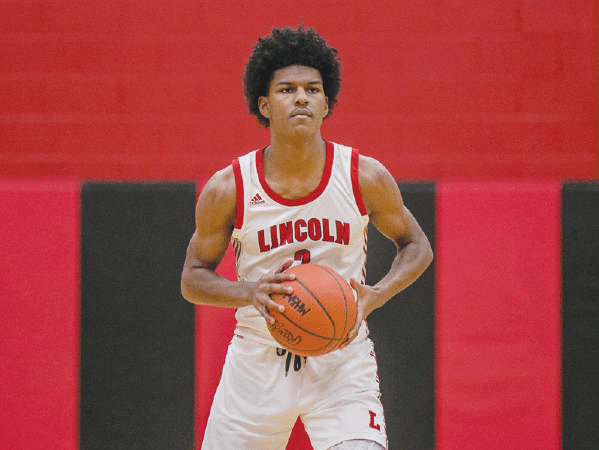   Warren Lincoln sophomore Markus Blackwell controls the ball against St. Clair Shores South Lake on Feb. 1 at Lincoln High School.  