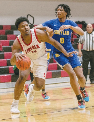  Lincoln junior Timarion Minor drives past a South Lake defender. 