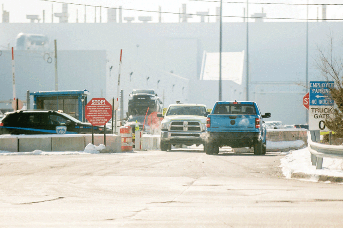  Security personnel monitor the 17 Mile Road entrance to the Stellantis Sterling Heights Assembly Plant. 