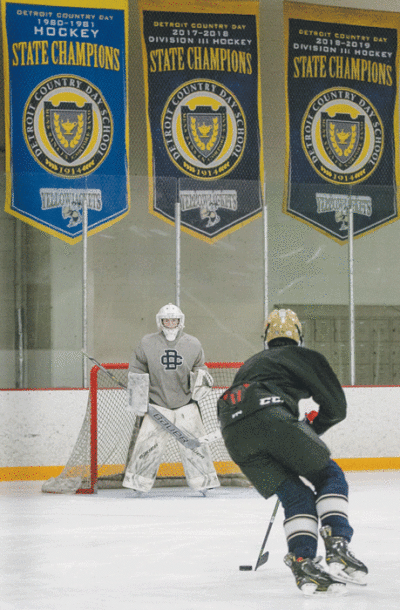  Detroit Country Day’s championship banners hang in the background at Southfield Sports Arena during the team’s practice Feb. 1. 