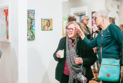  Gallery-goers smile with delight while enjoying the artwork during the Paint Creek Center for the Arts’ opening reception Feb. 4 for its first show of 2023, “Fresh Pasture.”  