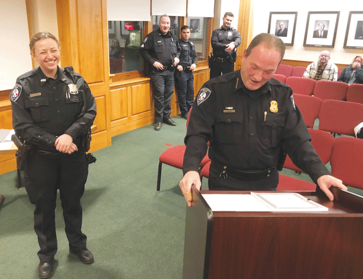  New Grosse Pointe Park public safety officer Emily McGrath, left, is introduced by Park Public Safety Director Bryan Jarrell, right, during a Jan. 9 Park City Council meeting. 