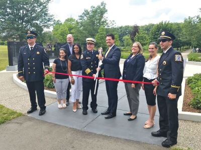  The mayor, the City Council and leaders of the Fire Department cut the ribbon on the new Firefighter Memorial at Firefighters Park June 26. 