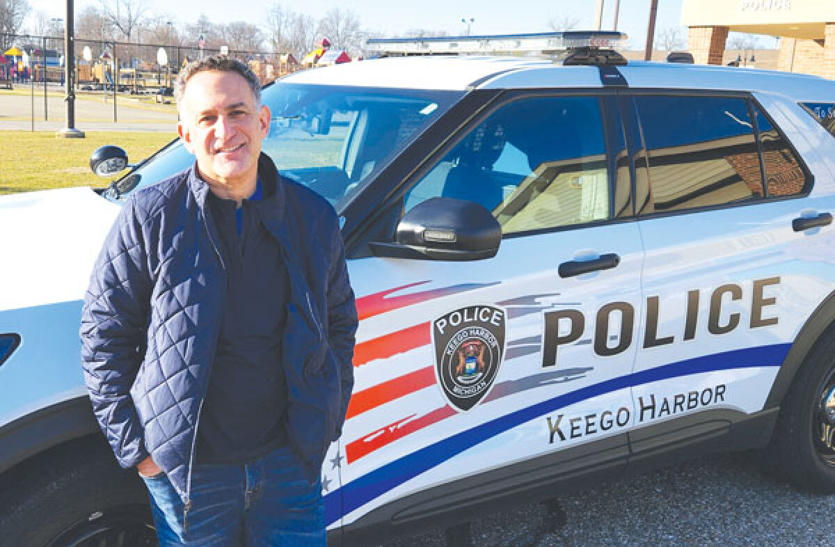  Keego Harbor Mayor Rob Kalman is pictured near a city police vehicle. After defeating a millage proposal in November, Keego residents can expect to see a dedicated police millage proposal back on the ballot in May. 