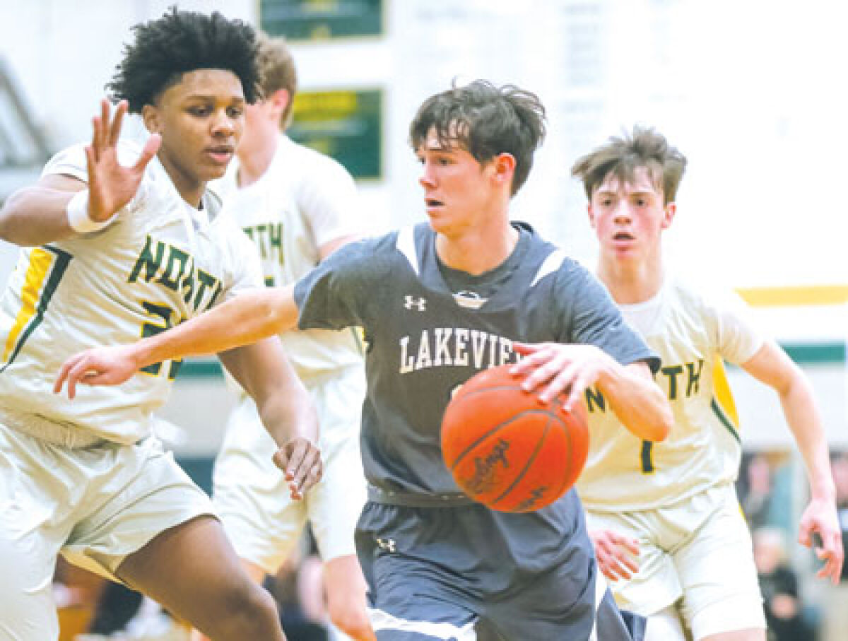 Lakeview senior Matthew Ritter drives past a Grosse Pointe North defender during Lakeview’s 69-50 loss against North. 