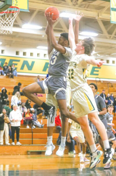  Lakeview senior Charrone Gordon drives to the basket with authority, bringing two Grosse Pointe North defenders with him. 