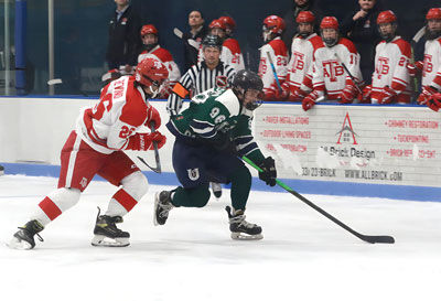  Chippewa Valley United senior Ryan Leduc holds the puck during Chippewa Valley United’s 4-2 win over Anchor Bay. 