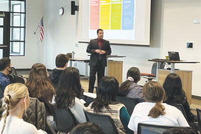  Troy Assistant Superintendent of Business Services Rick West tells district students about the different phases of asking for and using a bond as a special presentation Feb. 7. 