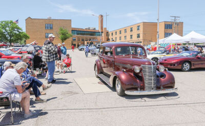  Classic cars and trucks, muscle cars and hot rods fill the parking lot at Eastpointe High School for the Anderson, Eckstein & Westrick car show. 