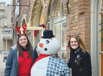  Since completing her marketing internship with the Romeo Downtown Development Authority last year, Madison Roush has been hired as the DDA’s administration and events coordinator. Roush, left, is pictured with  