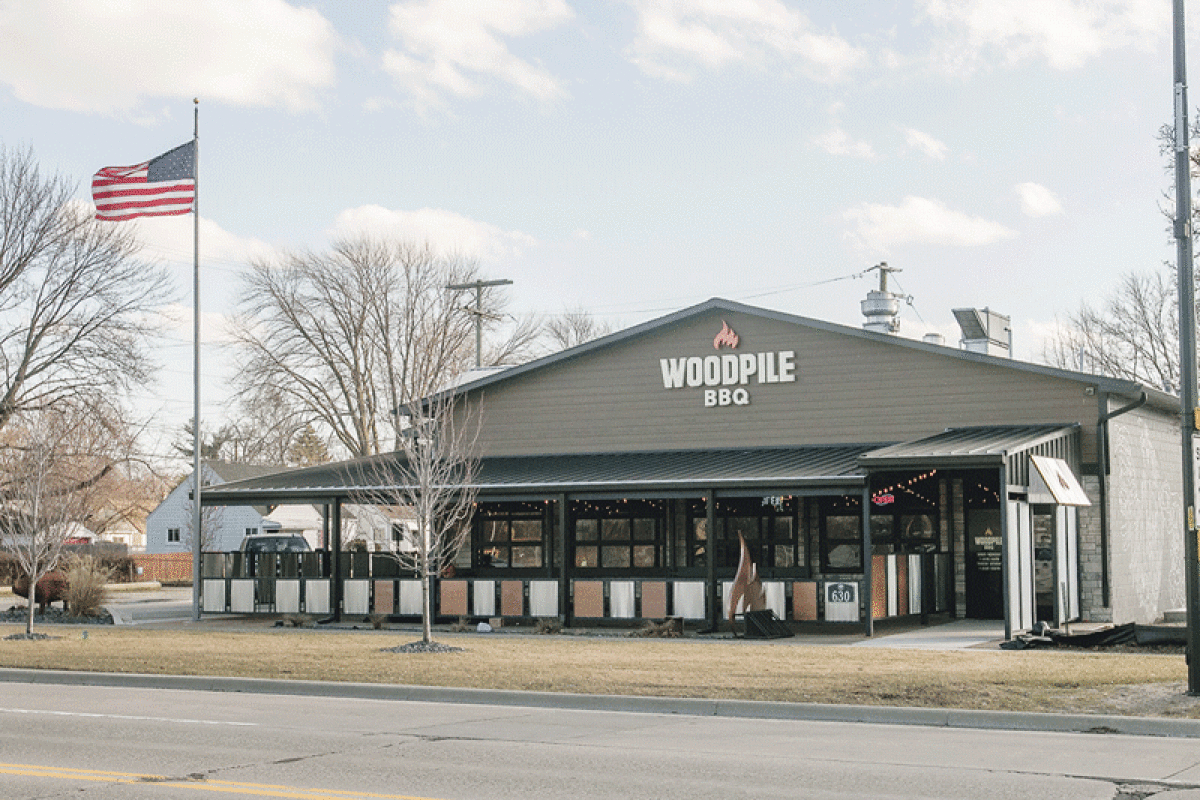  Woodpile BBQ is among the businesses in the downtown area where the city’s rewritten zoning ordinance is considering a “City Center” district that would further promote walkability in the area.  