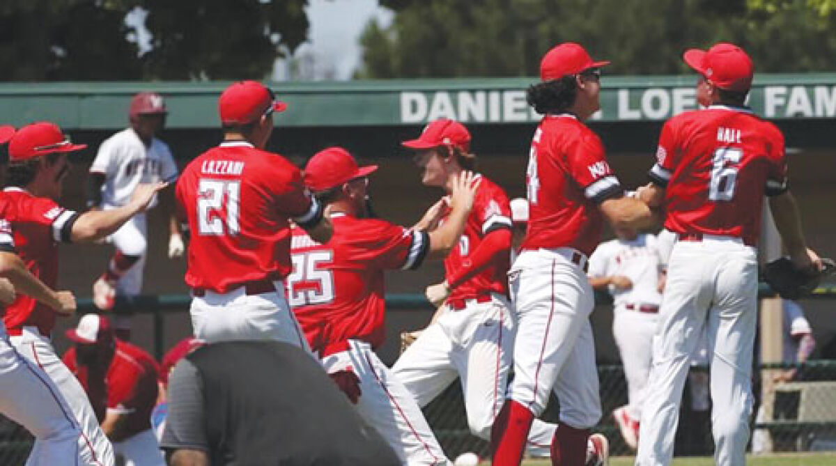  Clinton Township Chippewa Valley baseball celebrates its first-ever regional championship win over Detroit Western on June 11 at Wayne State University’s Harwell Field. 