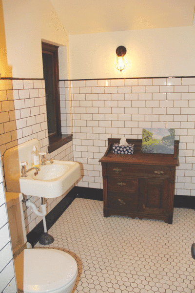  The lone bathroom in the Gate Lodge received historically correct restorations during interior work. 