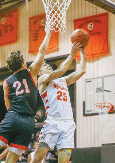   Brother Rice junior Chase Van Ameyde goes for the layup. 