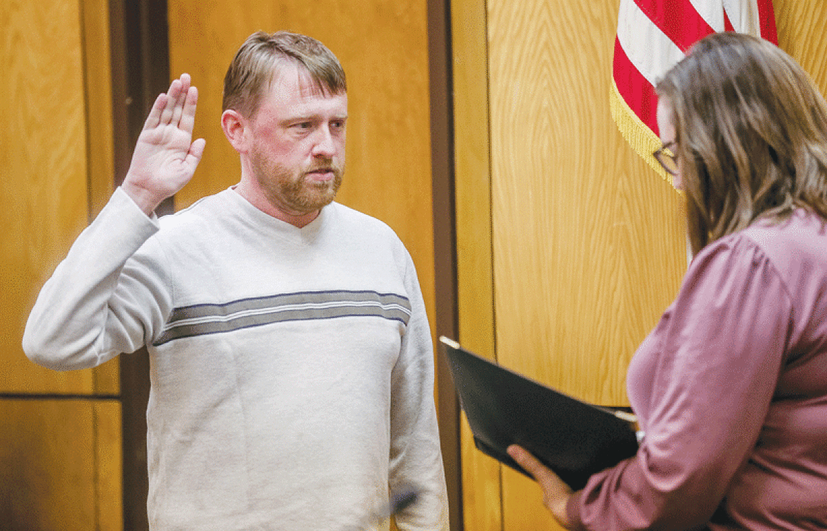  Erik Rick is sworn in as a member of the Mount Clemens City Commission by City Clerk Cathleen Martin Feb. 23. 