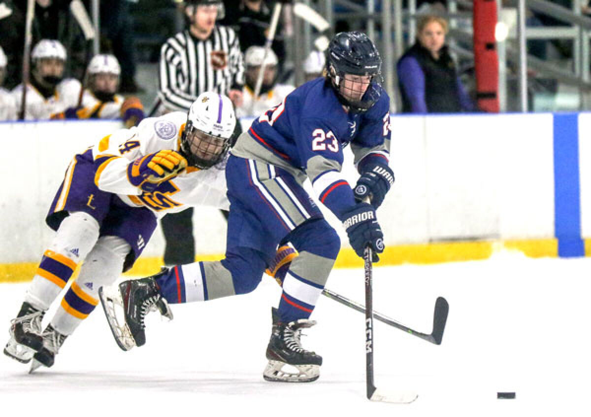  SCS Unified sophomore Brennen Lenk controls the puck during their 7-2 loss against De La Salle on March 1. 