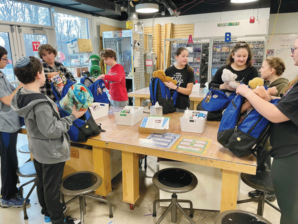  Students at Hillel Day School in Farmington Hills embarked on a semester-long class that included stuffing backpacks with items of comfort for patients with pediatric cancer. 