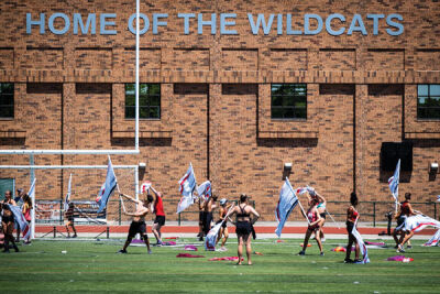 The drum corps’ color guard warms up. 