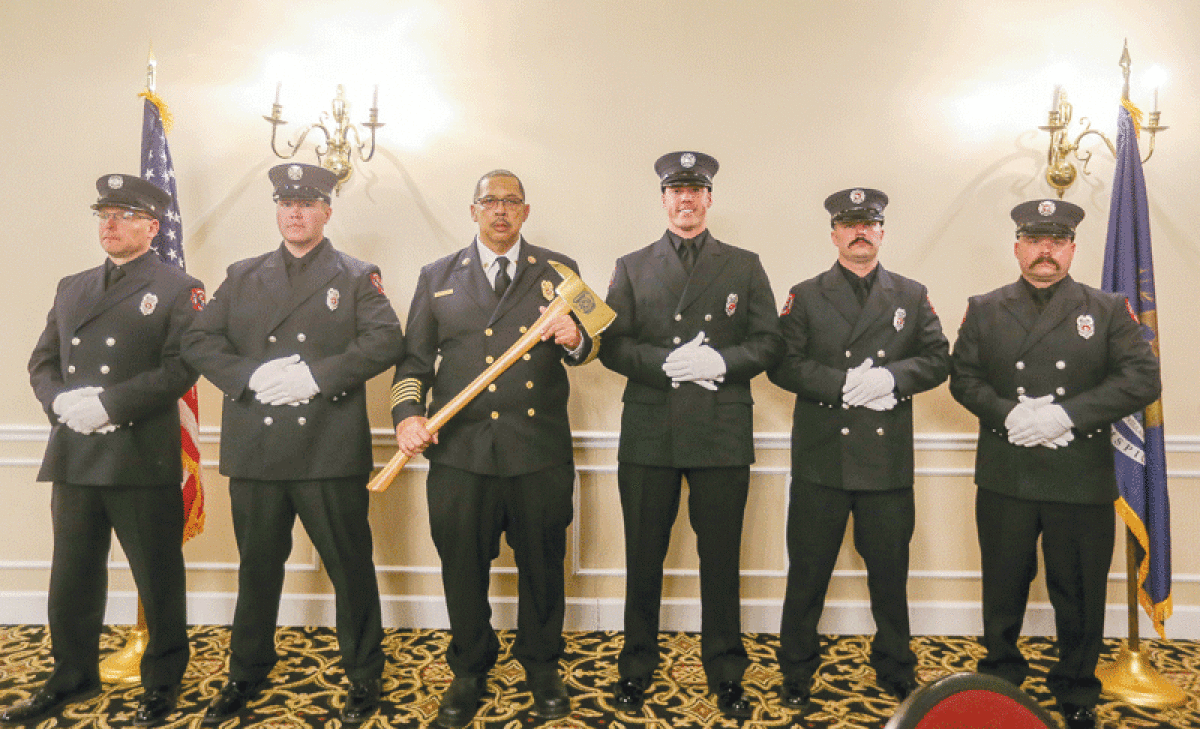  Warren Fire Commissioner Wilburt “Skip” McAdams, holding the ax, was joined by members of the Warren Fire Department Honor Guard at the annual awards ceremony on March 8. Accompanying McAdams, from left, were Rick Breen, Michael Carnay, Kyle Morrow, Colvin Taylor and Brian Haynes. 