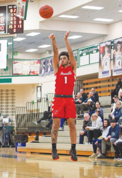  Roseville senior guard Terrence Partridge launches a shot from behind the arc. 