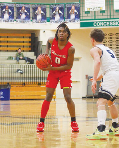  Roseville junior guard Jalen Mosley looks for a teammate against Macomb Dakota. 