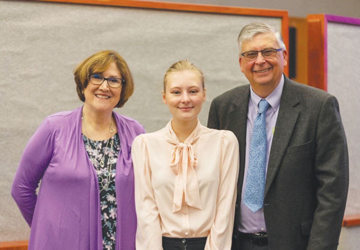  Macomb Community College student Elise Radzioch, 19, of Sterling Heights, center, was the recipient of the Laura K. Osaer, D.O., Memorial Endowed Scholarship for the Sciences. Pictured with her are Laura Osaer’s parents, Debbie Osaer, left, and Rob Osaer, right. 