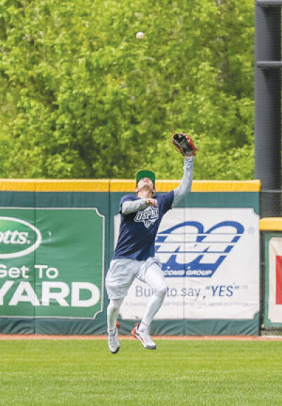  Birmingham Bloomfield Beavers infielder Cameron Collett tracks down a fly ball in the outfield. 