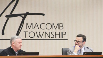  At the March 8 Macomb Township Board of Trustees meeting, Township Treasurer Leon Drolet asks Department of Public Works Director Kevin Johnson about broken pool dehumidification motors while Township Supervisor Frank Viviano and Clerk Kristi Pozzi watch on. 
