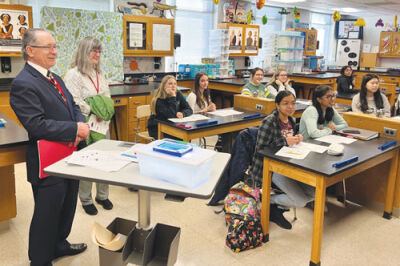  Michigan Superintendent Michael Rice and State Library Grant Coordinator Karen Reish visit a biology classroom at Troy School after the school’s media center was named Model School Library of the Year. 