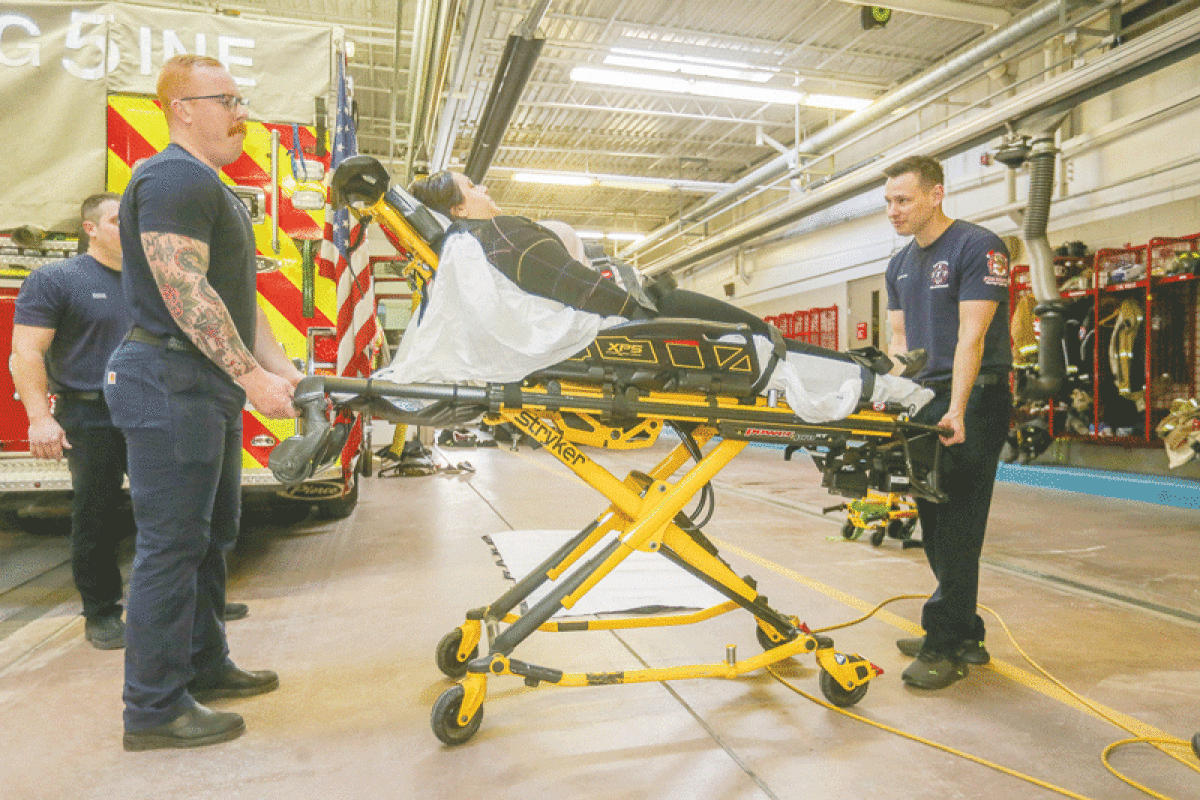  Sterling Heights Fire Department personnel demonstrate the use of a stretcher at Fire Station No. 5. 